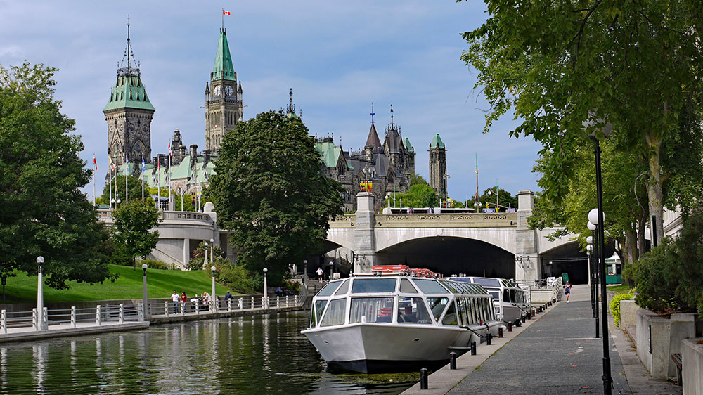 View along Rideau Canal to Parliament Building in Ottawa.